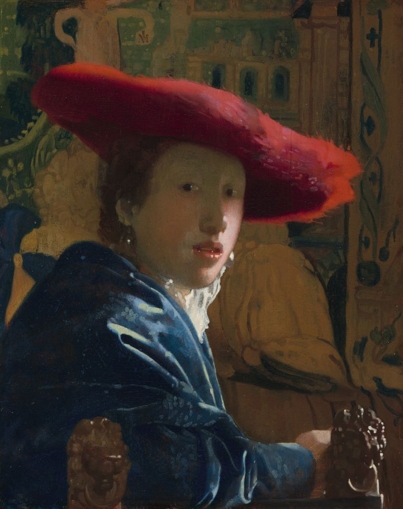 Johannes Vermeer schilderde in zijn loopbaan een handvol tronies. Dit 'Meisje met rode hoed' is een van de bekendste, naast uiteraard 'Meisje met de parel'. Dit is ook het kleinste (bewaarde) werkje dat Vermeer ooit schilderde.